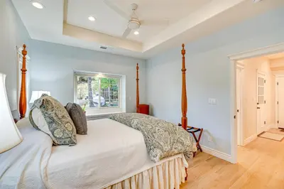 a bedroom with a bed with pillows on it at Auburn Farmhouse with Fireplace, Close to Wineries in Auburn