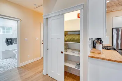 a bedroom with a closet with a bed in it at Auburn Farmhouse with Fireplace, Close to Wineries in Auburn