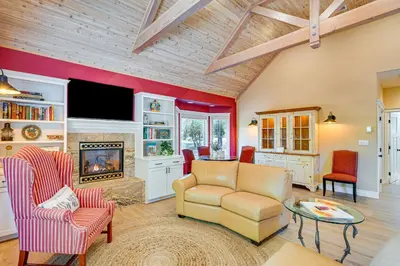 a living room with a couch and a fireplace at Auburn Farmhouse with Fireplace, Close to Wineries in Auburn