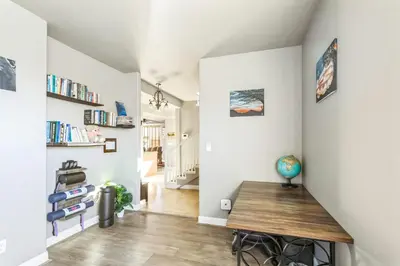 a room with a wooden table and a hallway at Beautiful Sunsets at 3BR Villa in Reno in Reno