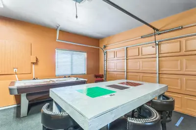 a kitchen with a table and some cabinets at Beautiful Sunsets at 3BR Villa in Reno in Reno