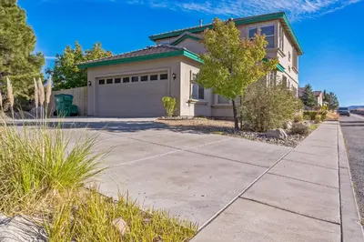 a house with a driveway and a garage at Beautiful Sunsets at 3BR Villa in Reno in Reno
