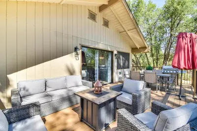 a patio with couches and a table at 1 Mi to Pine Mountain Lake Marina Yosemite Cabin! in Groveland