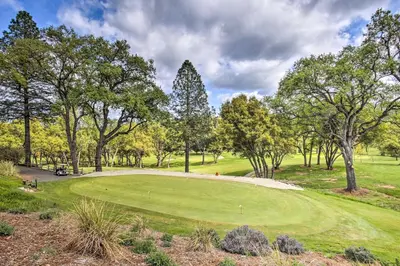 a view of a golf course with a green at 1 Mi to Pine Mountain Lake Marina Yosemite Cabin! in Groveland