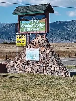 a sign for a meadow lodge fish camp at Big Meadow Lodge in Bridgeport