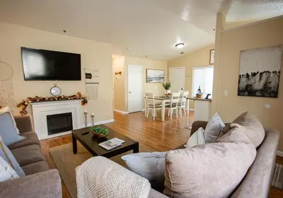 a living room with two couches and a fireplace at Cozy Condo minutes from the Sequoia National Park in Three Rivers