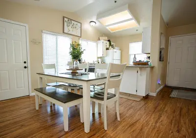 a kitchen and dining room with a table and chairs at Cozy Condo minutes from the Sequoia National Park in Three Rivers