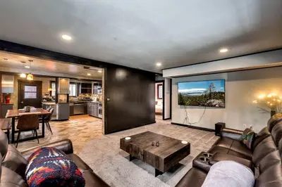 a living room with a couch and a table at New Cabin in North Lake Tahoe! in Kings Beach