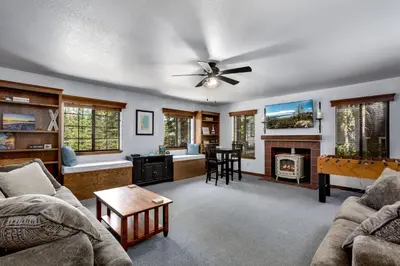 a living room with a couch and a table at Large Seasonal Rental South Lake Tahoe in South Lake Tahoe