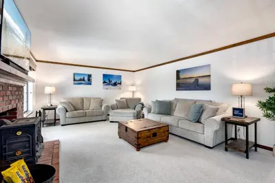 a living room with two couches and a fireplace at Large Seasonal Rental South Lake Tahoe in South Lake Tahoe