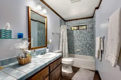 a bathroom with a sink and a toilet and a tub at Large Seasonal Rental South Lake Tahoe in South Lake Tahoe
