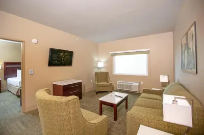 a living room with a couch and chairs and a bed at Gold Dust West in Carson City