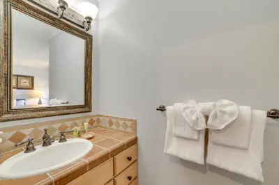 a bathroom with a sink and a mirror at Walk to Ski Lift Mtn-View Condo in Mammoth Lakes in Mammoth Lakes