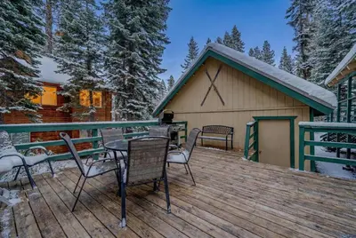 a deck with chairs and a grill on a house at Near Northstar Wooded Retreat with Deck & Loft in Tahoe Vista