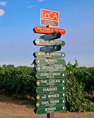 a sign with lots of signs on it at Charming 3 Bedroom Farmhouse Retreat with Open Deck in Acampo