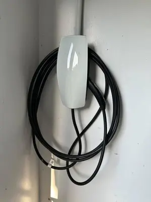 a computer mouse on a cord attached to a wall at Charming 3 Bedroom Farmhouse Retreat with Open Deck in Acampo