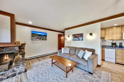 a living room with a couch and a fireplace at TML 04 - Beautiful 1 BR Condo in Tahoe City in Tahoe City