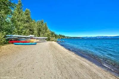 a group of boats on the shore of a lake at TML 04 - Beautiful 1 BR Condo in Tahoe City in Tahoe City