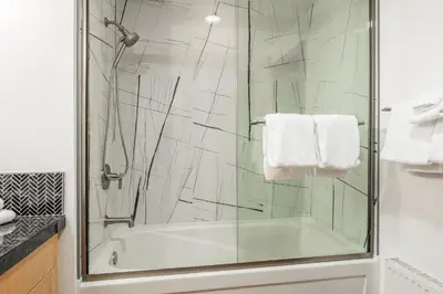 a bathroom with a shower with a glass door at Solstice 17 in Mammoth Lakes
