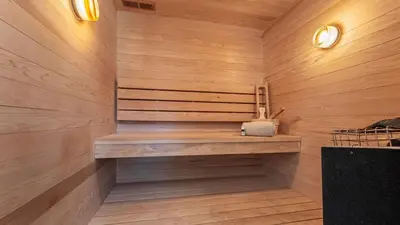 a sauna with wooden walls and a bench in a room at Northwood Mountain Views Sauna Balcony Tahoe Group Retreat in Incline Village