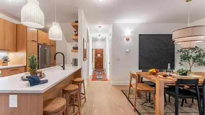 a kitchen and dining room with a table and chairs at Northwood Mountain Views Sauna Balcony Tahoe Group Retreat in Incline Village