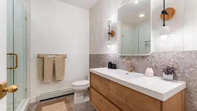 a bathroom with a sink and a toilet and a mirror at Northwood Mountain Views Sauna Balcony Tahoe Group Retreat in Incline Village