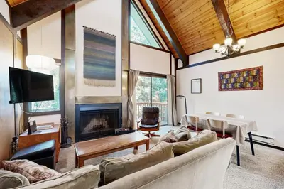 a living room with a couch and a fireplace at Tahoe Tranquility in Incline Village