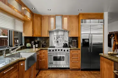 a kitchen with a stainless steel stove and refrigerator at Third Creek- Experience the Ultimate in Luxury in Incline Village