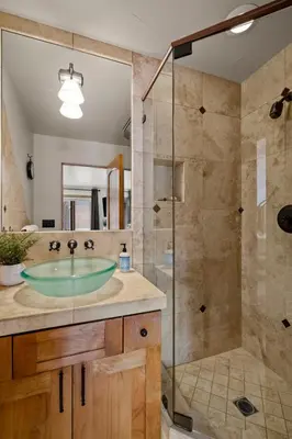 a bathroom with a sink and a glass shower at Third Creek- Experience the Ultimate in Luxury in Incline Village