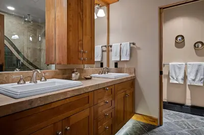 a bathroom with two sinks and a large mirror at Third Creek- Experience the Ultimate in Luxury in Incline Village