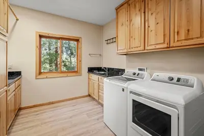a laundry room with a washer and dryer at Do not miss your chance to vacation at this five bedroom 5 bath mountain home in Incline Village