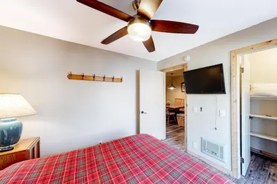 a bedroom with a bed and a ceiling fan at Crestview 48 in Mammoth Lakes