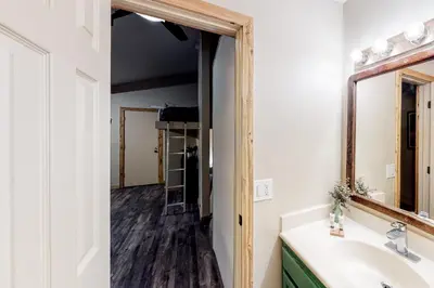a bathroom with a sink and a mirror at Crestview 48 in Mammoth Lakes