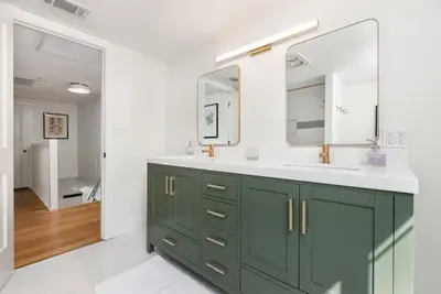 a bathroom with a green sink and a mirror at Luxury Lake Home-The Bear Claw-Boat Slip-Sleeps 16 in Bass Lake