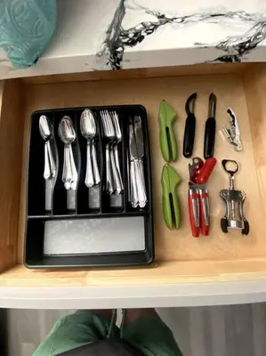 a drawer filled with utensils on a shelf at Entire House in Old Fig Garden in Fresno