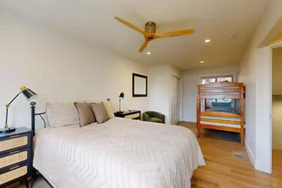 a bedroom with a bed and a ceiling fan at Towering Pine in Incline in Incline Village