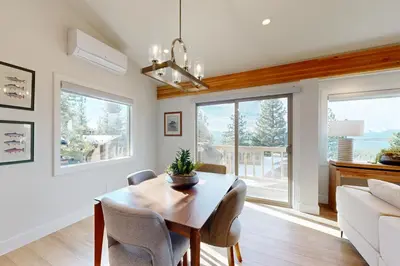 a dining room with a table and a couch at Towering Pine in Incline in Incline Village