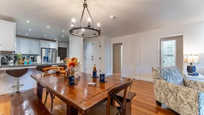 a kitchen and living room with a wooden table at Walk to Lake DiningShops 5mins to Ski Resort Incline Paradise by AvantStay in Incline Village