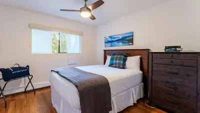 a bedroom with a bed and a dresser at Walk to Lake DiningShops 5mins to Ski Resort Incline Paradise by AvantStay in Incline Village