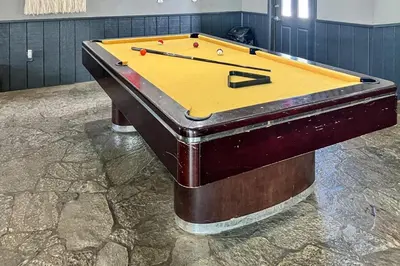 a pool table with balls on top of it at Chamonix 36 in Mammoth Lakes