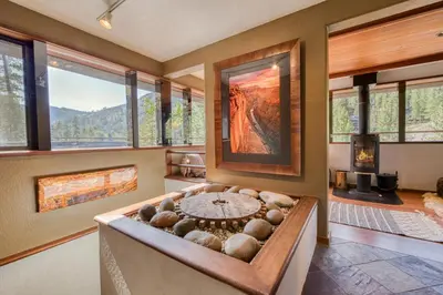 a room with a bathtub with a view at Spire Chalet at Alpine Meadows - 4BR W Hot Tub and Ski Shuttle in Alpine Meadows