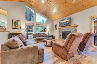 a living room with a couch and a fireplace at Kings Beach Retreat, Hot Tub, Walk to Beach in Kings Beach