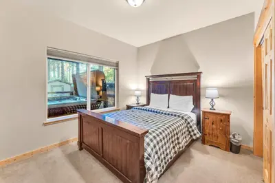 a bedroom with a bed and a window at Kings Beach Retreat, Hot Tub, Walk to Beach in Kings Beach