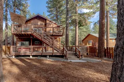 a tree house in the woods with a staircase at Kings Beach Retreat, Hot Tub, Walk to Beach in Kings Beach