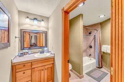 a bathroom with a sink and a shower at Secluded Tahoe Retreat by Northstar with Hot Tub in Truckee
