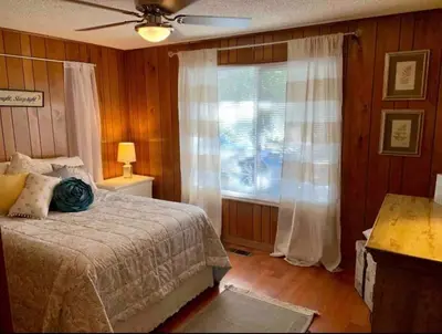 a bedroom with a bed and a window at Midtown Old Southwest Home With Pool! in Reno