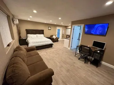 a living room with a couch and a bed at Private Old Southwest Casitas in Reno