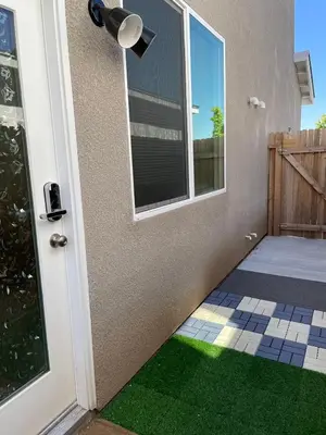 a door with a green floor and a window at Cozy-Quiet-Spacious Guest Suite in Fresno Clovis California in Fresno