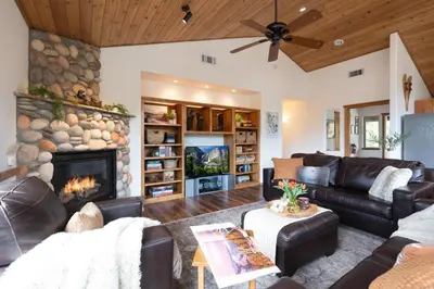 a living room with a couch and a fireplace at Yosemite Summit & Little Summit in Yosemite West