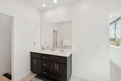 a bathroom with a sink and a mirror at Spacious 3BR Home with Charming Backyard home in Folsom